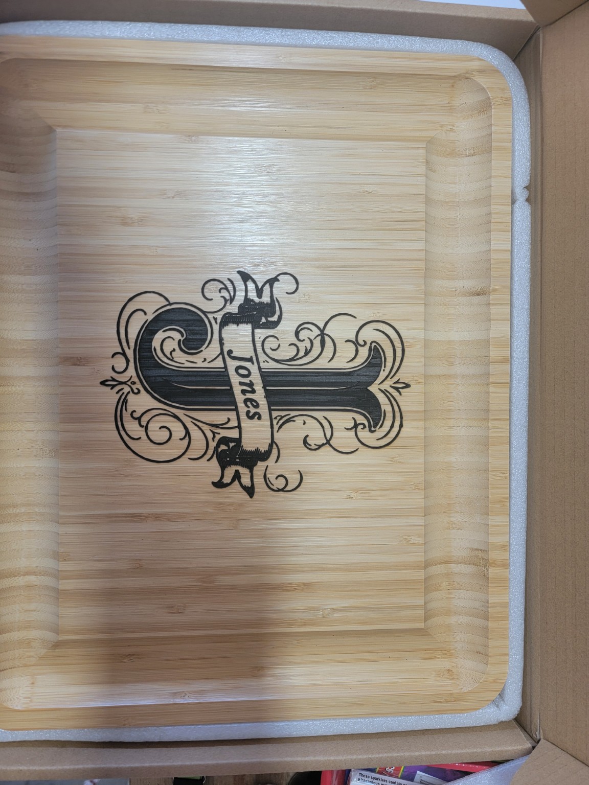 Engraved decorative cross on wood tray